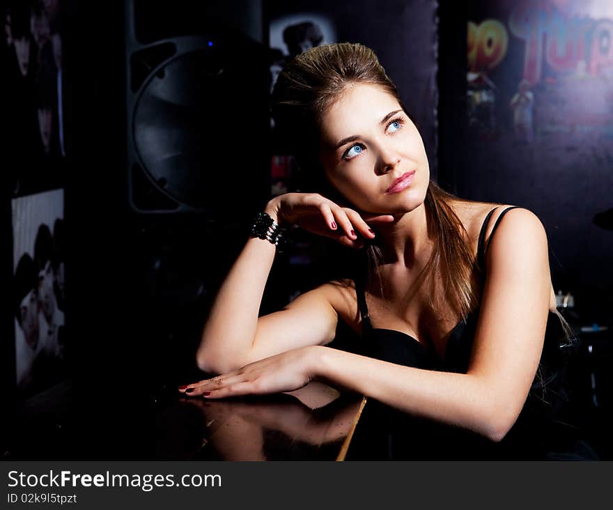 Beautiful young sad blond girl in the bar. Beautiful young sad blond girl in the bar