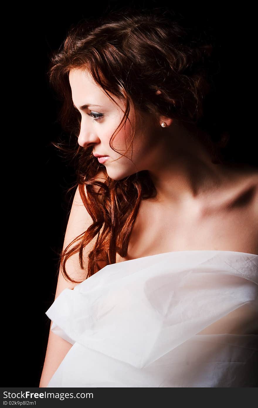 Portrait of a alluring young girl in on black background. Portrait of a alluring young girl in on black background.