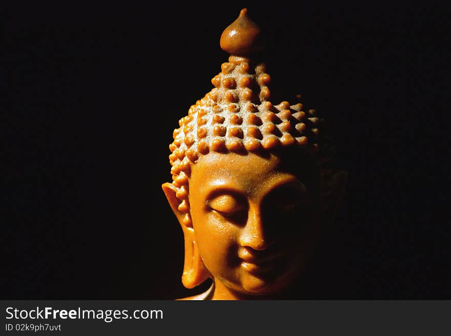 Light of Buddha image in the dark background.