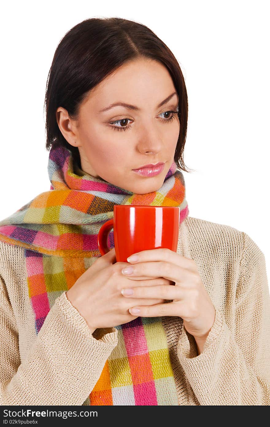 Yougn beautiful woman in warm scarf with a cup of tea. Yougn beautiful woman in warm scarf with a cup of tea