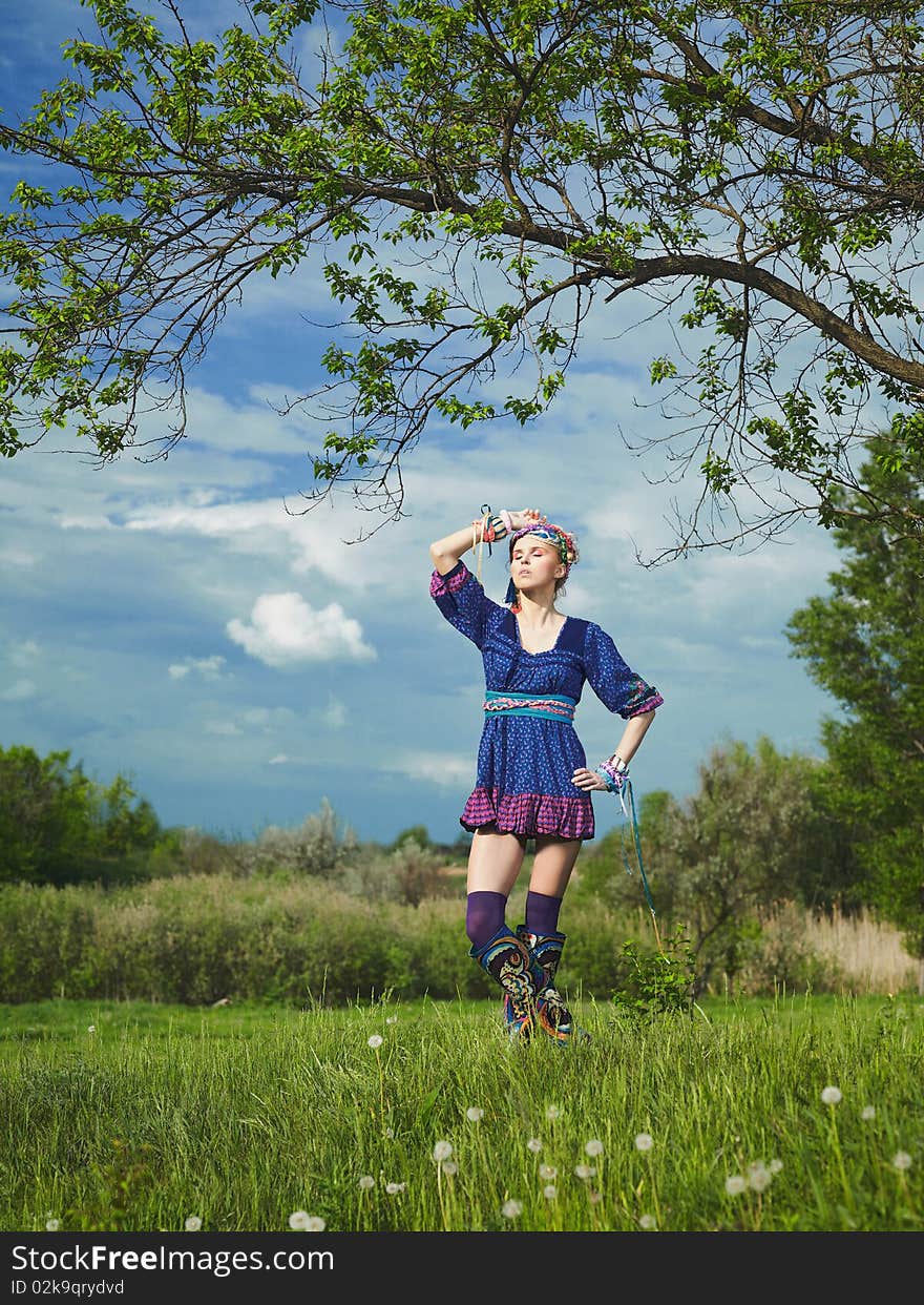 Beautiful young woman standing on grass