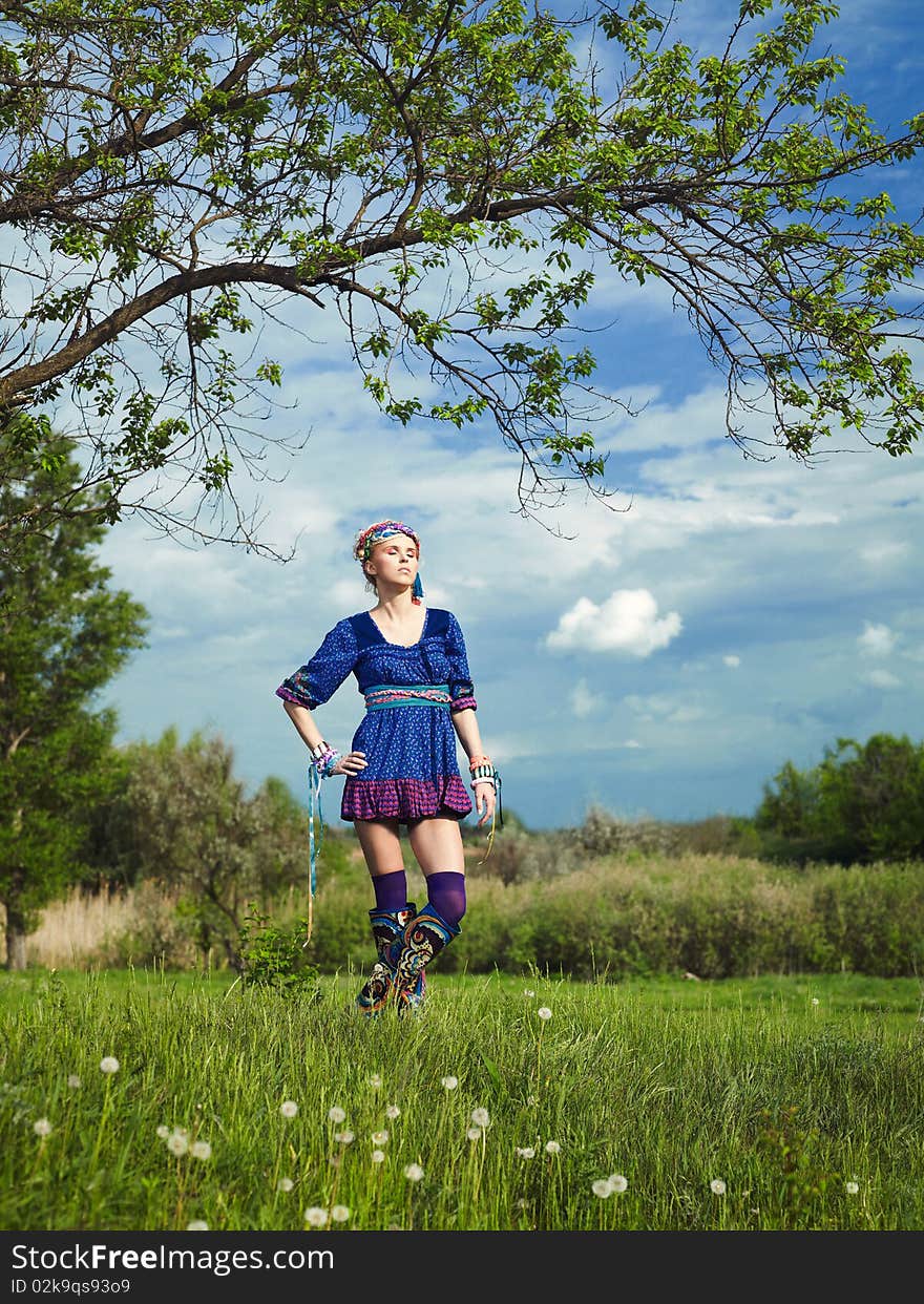 Beautiful young woman standing on grass