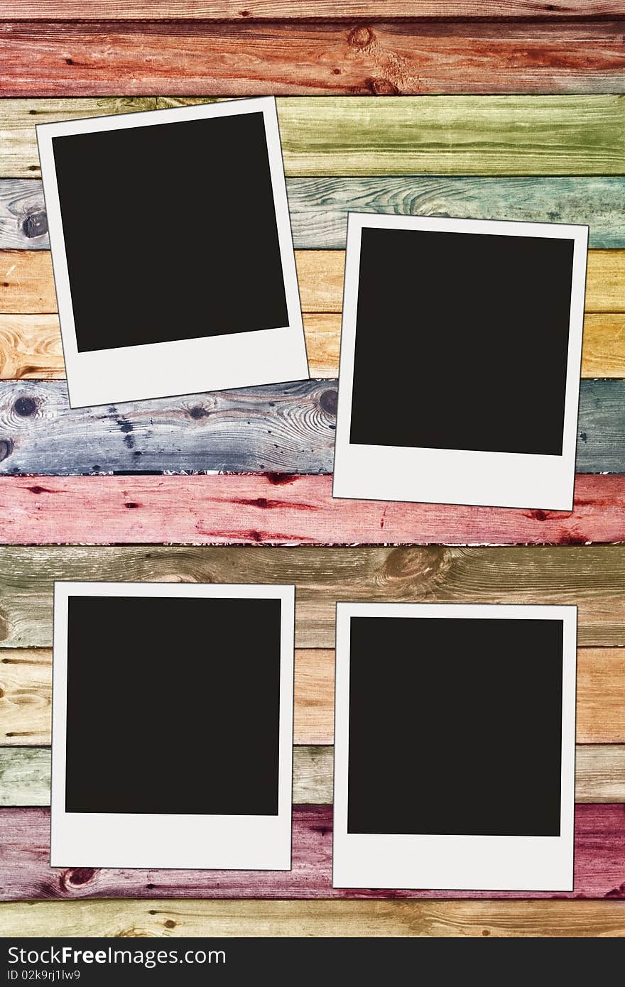 Blank photos on vintage wooden wall