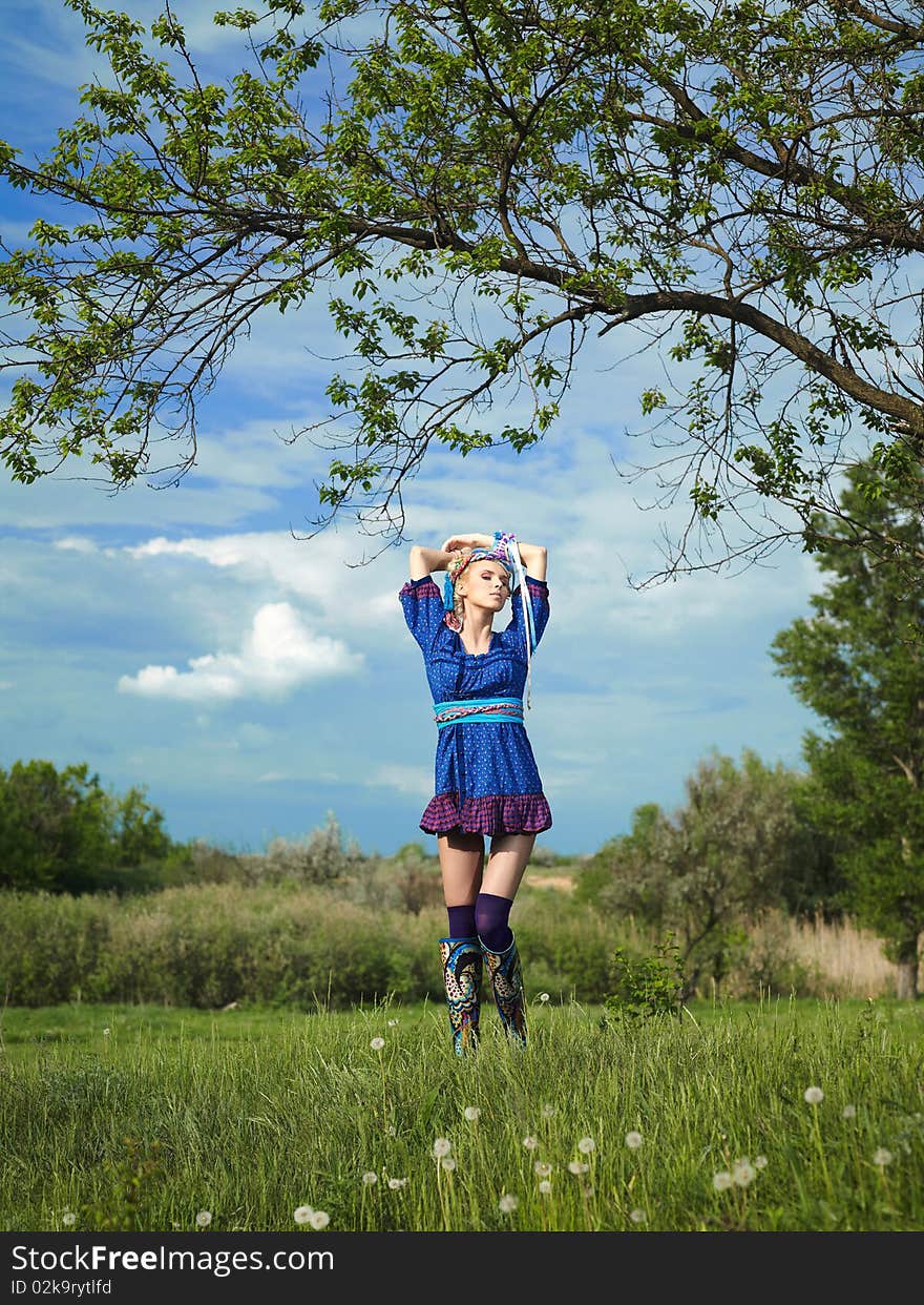 Beautiful young woman standing on grass