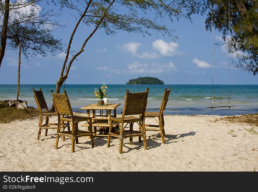 Table and chairs on the beach