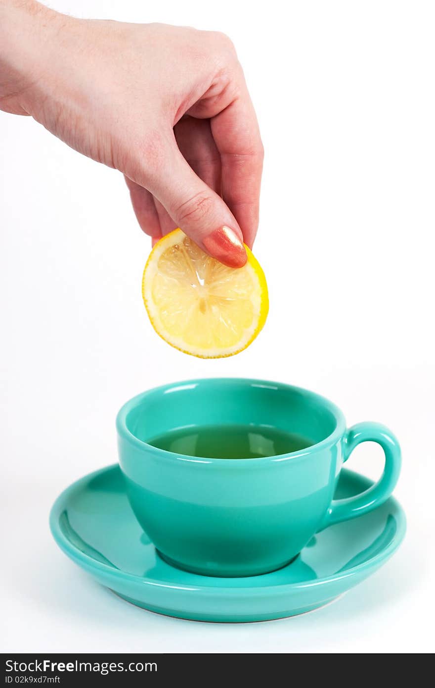 Hand Holding A Piece Of Lemon