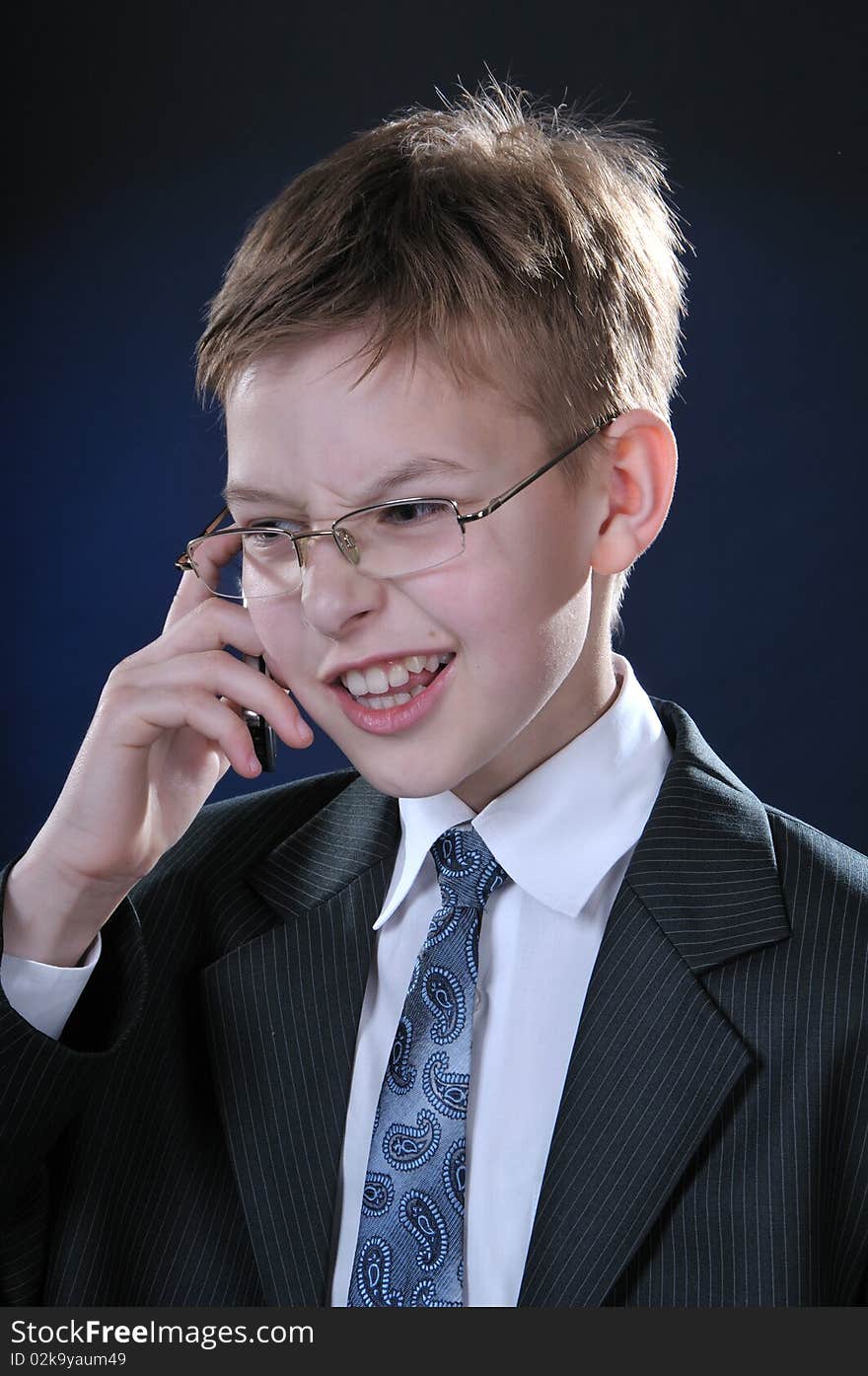 Boy In Suit On Cellphone