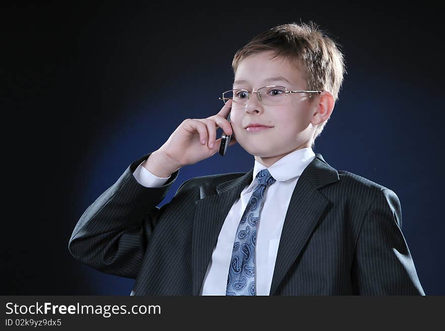 Boy In Suit On Cellphone