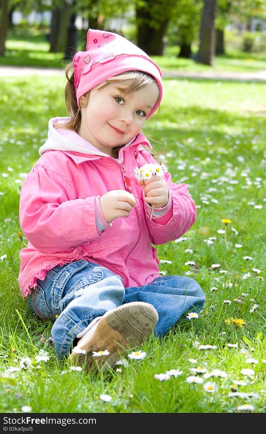 Sweet happy little girl in park