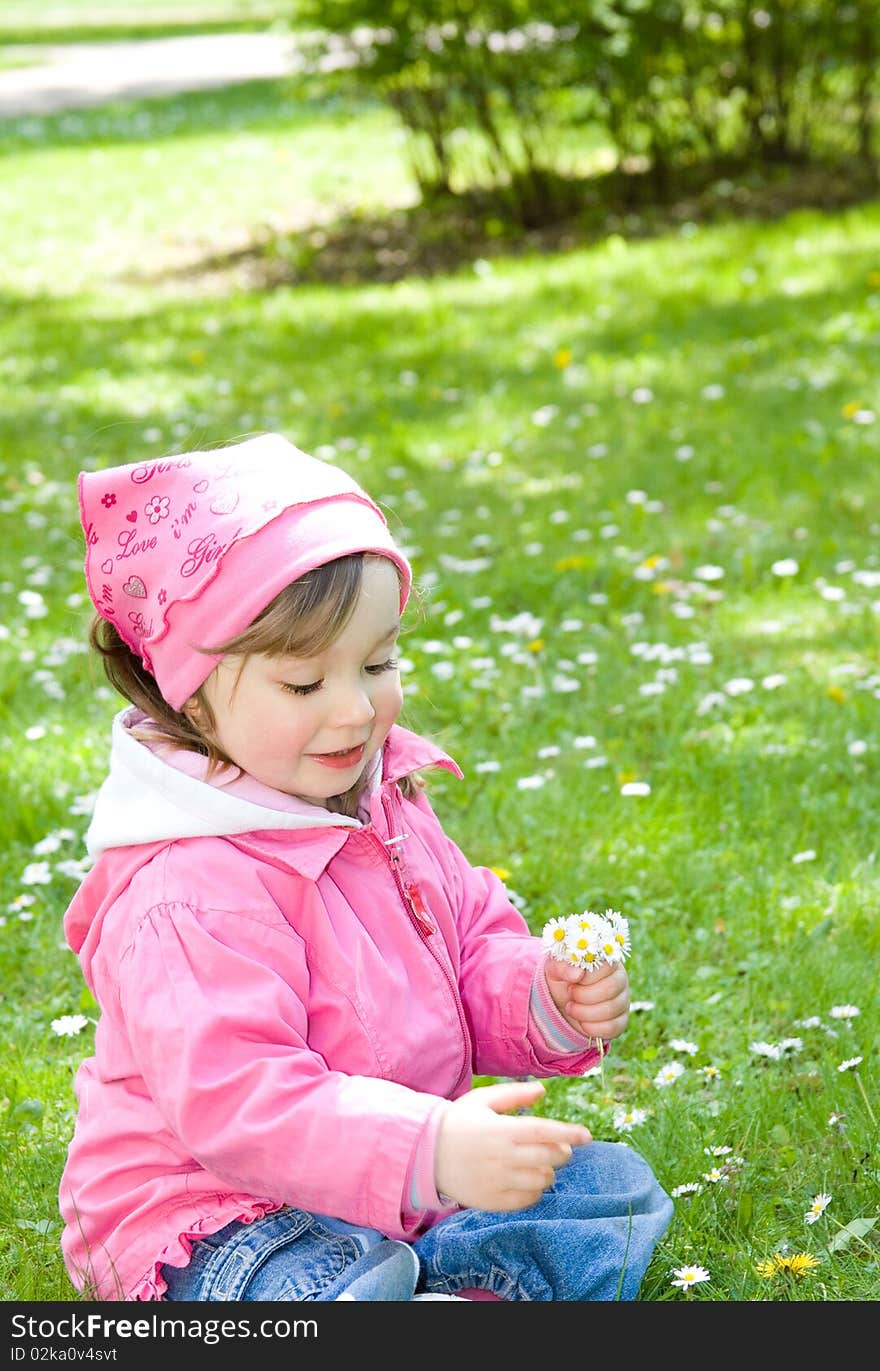 Sweet happy little girl in park