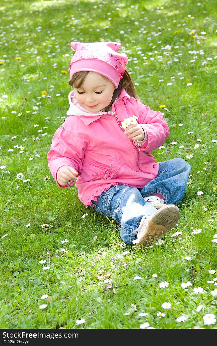 Sweet happy little girl in park