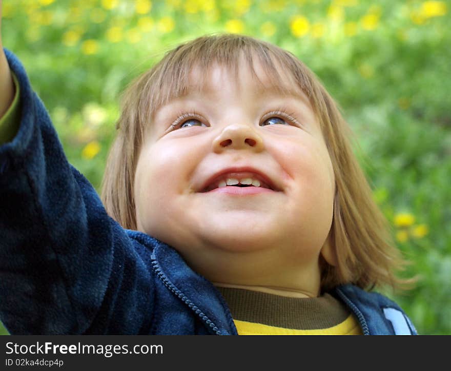 A child looks at the sky in the park