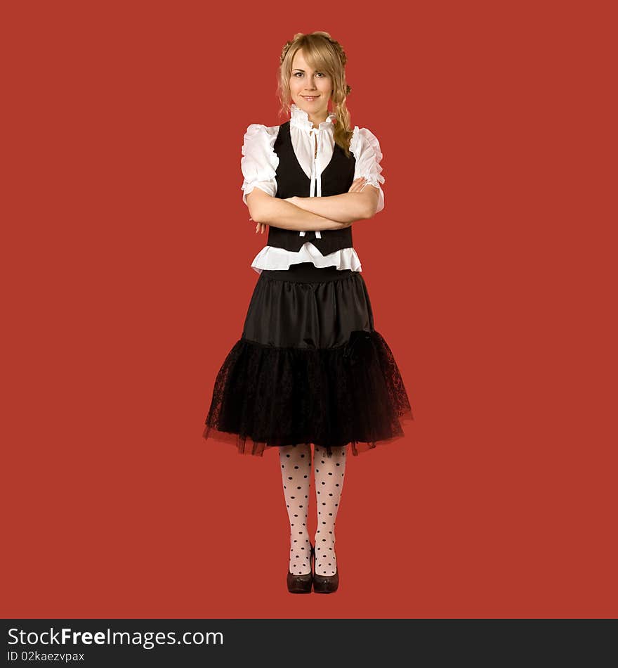 Attractive girl in fashionable clothes - isolated on red