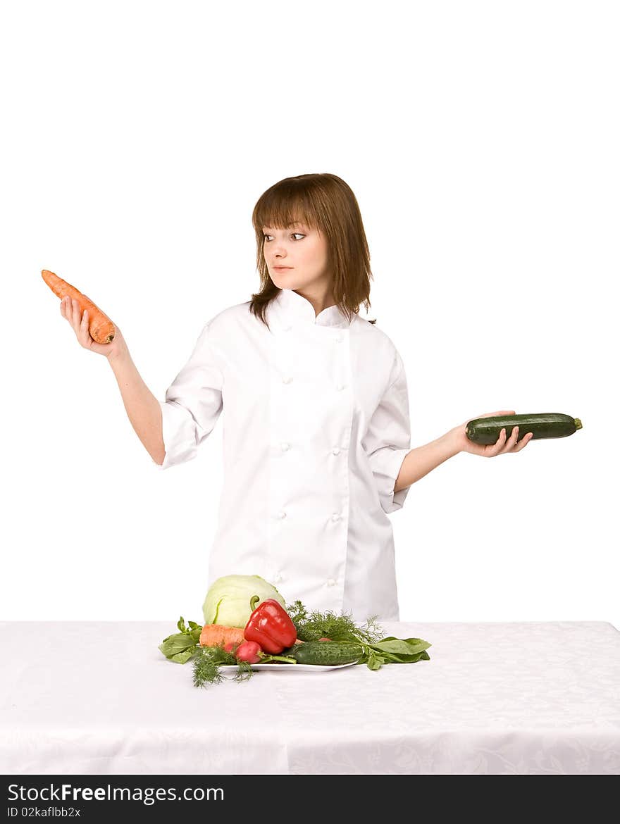 Cook girl holding squash and carrots