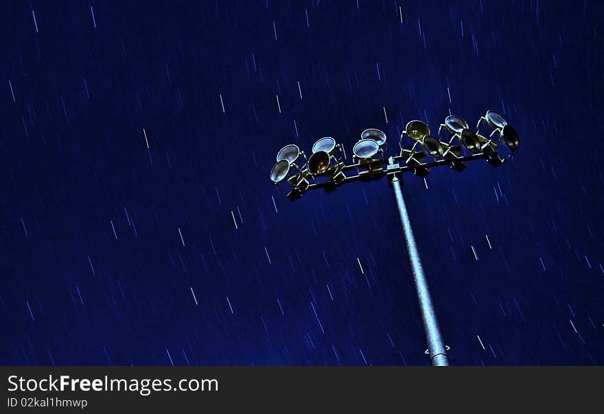 Star pattern behind field lights. Star pattern behind field lights