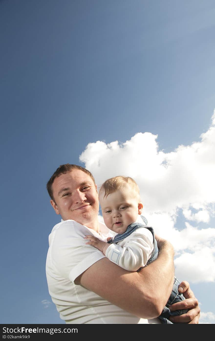 Little boy at the hands of his father, paternal care. Little boy at the hands of his father, paternal care