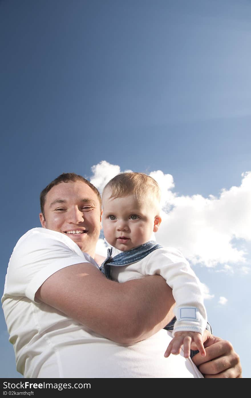 Little boy at the hands of his father, paternal care. Little boy at the hands of his father, paternal care