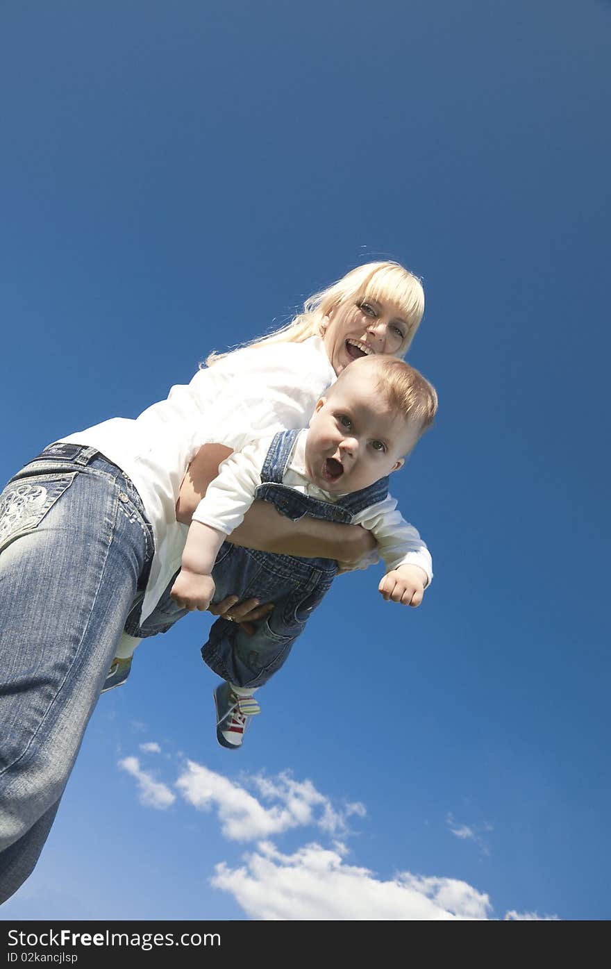 Little boy at the hands of his mother, paternal care. Little boy at the hands of his mother, paternal care