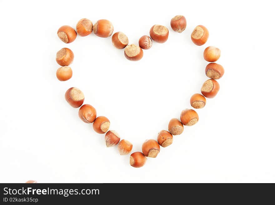 A nuts in shape of heart isolated on white