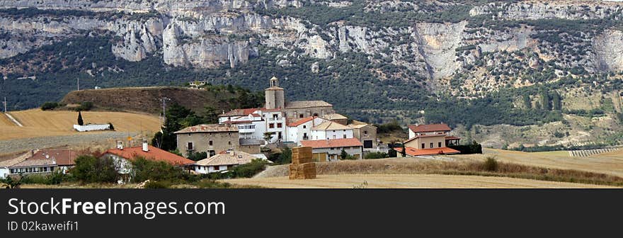 Small village surrounded with fields of cereal.