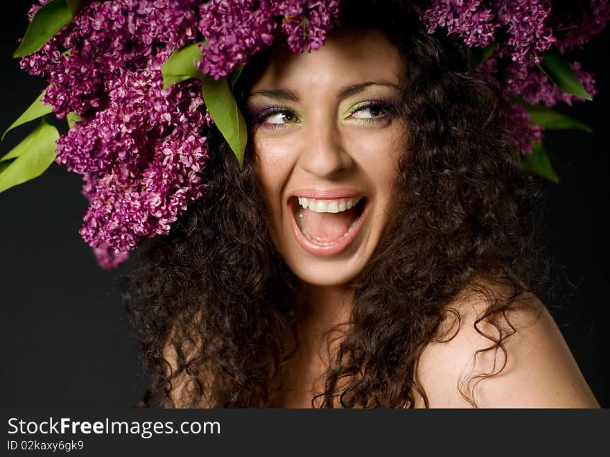 Girl in lilac garland laughing