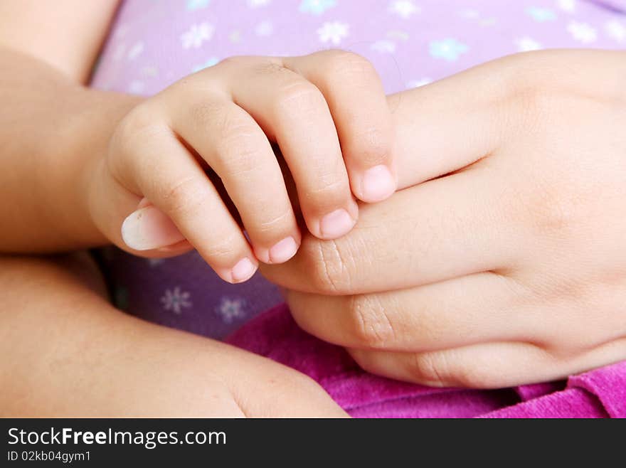 Mother and daughter holding hands. Mother and daughter holding hands