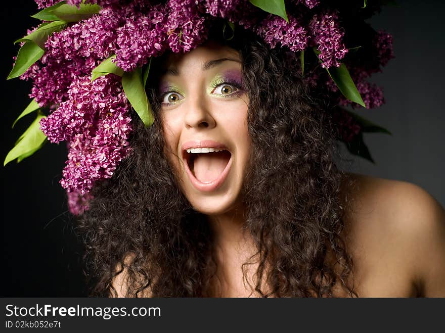 Girl in lilac garland laughing