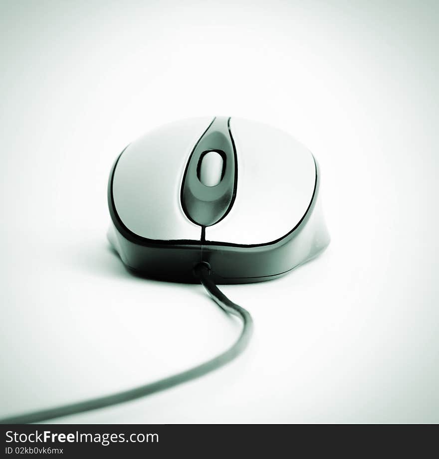 Mouse with cable over gray background. Gray image. Mouse with cable over gray background. Gray image