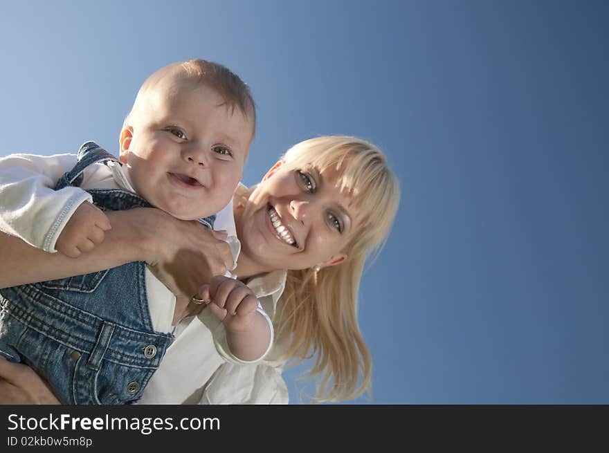 Little boy at the hands of his mother, paternal care. Little boy at the hands of his mother, paternal care