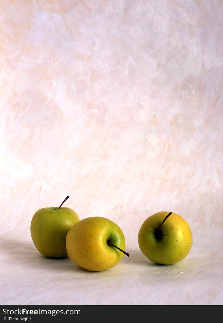 Three apples isolated on painted background