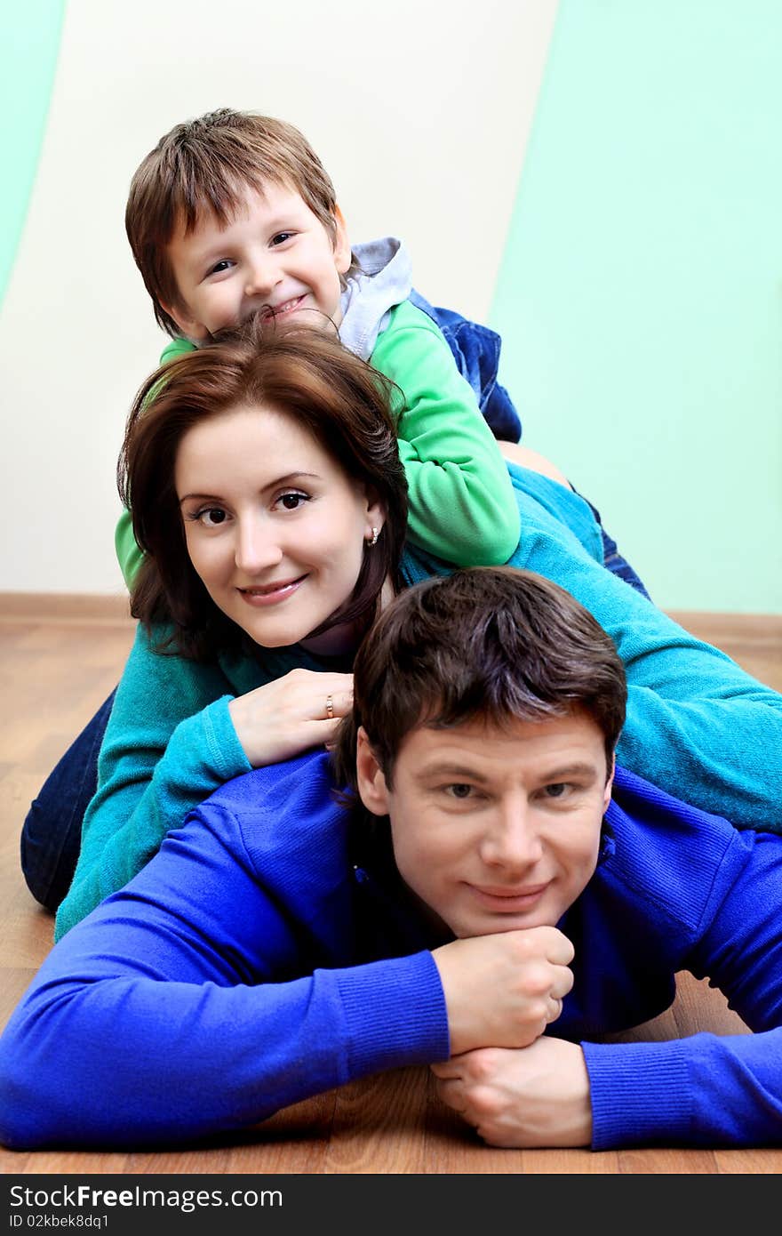 Happy family with a child at home. Happy family with a child at home.