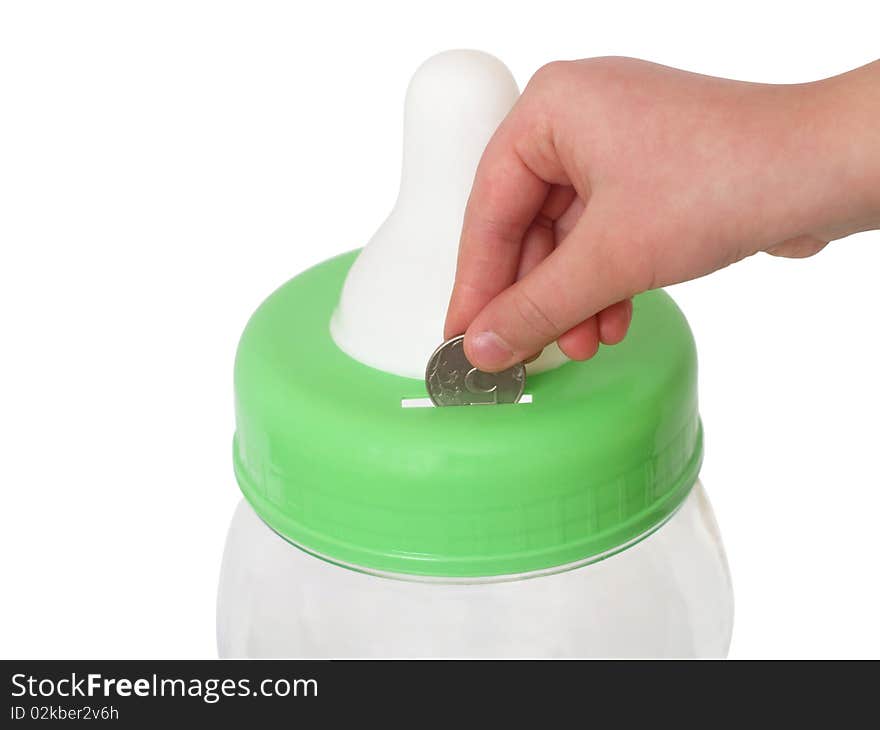 Fingers of a children's hand throwing a coin in a coin box close up on a white background it is isolated. Fingers of a children's hand throwing a coin in a coin box close up on a white background it is isolated