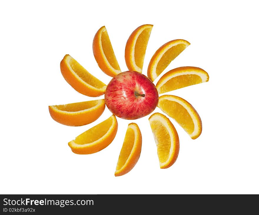 The big red apple and orange segments on a white background close up. The big red apple and orange segments on a white background close up