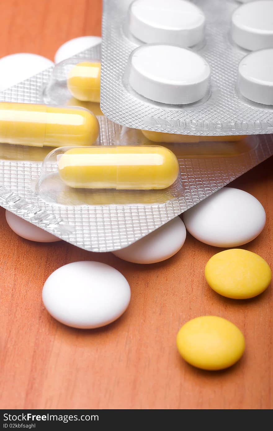 Heap of pills and medicine on a table. Heap of pills and medicine on a table