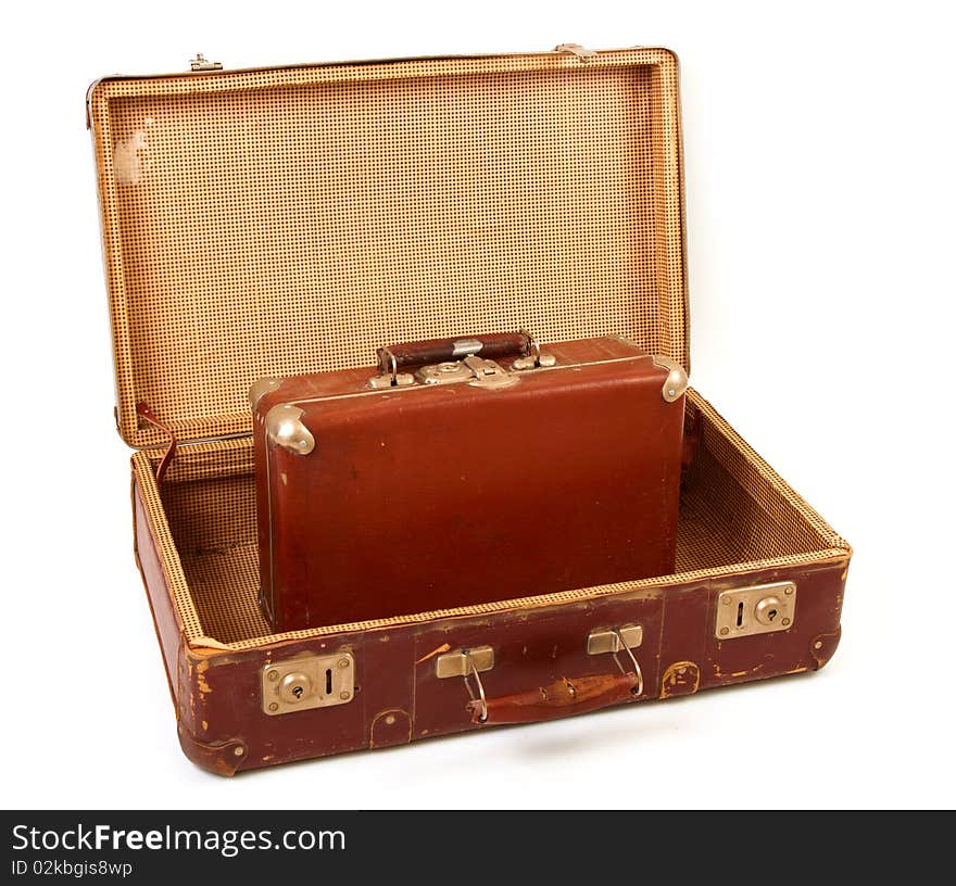 Two old suitcases for travel on white background