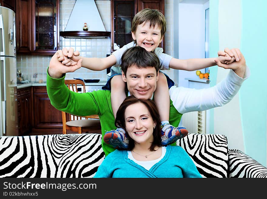 Happy family with a child at home. Happy family with a child at home.