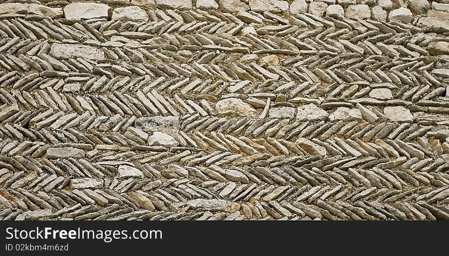 A rstoned wall in a traditional French village. A rstoned wall in a traditional French village