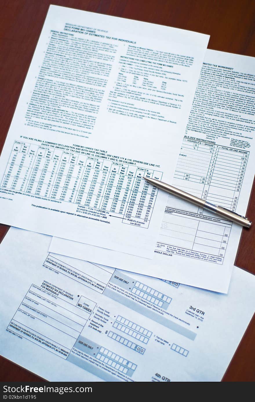 Tax form with pen on a desk.