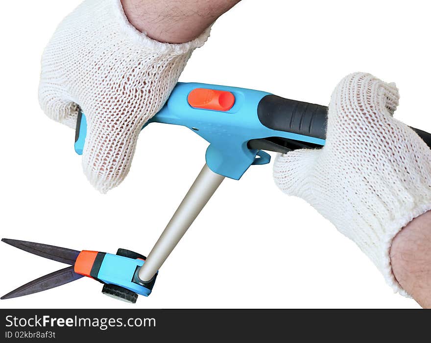 Man's hands in gloves and long handle garden scissors on a white background. Man's hands in gloves and long handle garden scissors on a white background