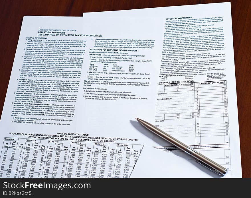 Tax form with pen on a desk.