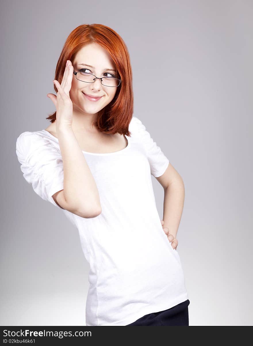 Smiling Red-haired Businesswoman In Sunglasses