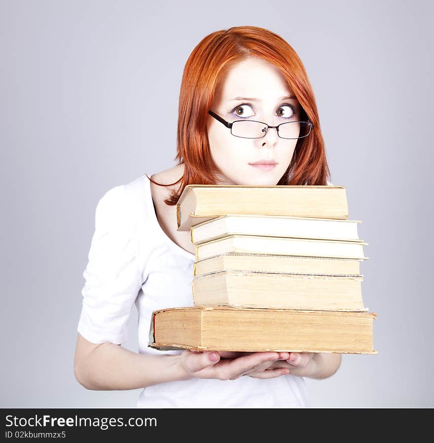 Red-haired businesswoman keep books