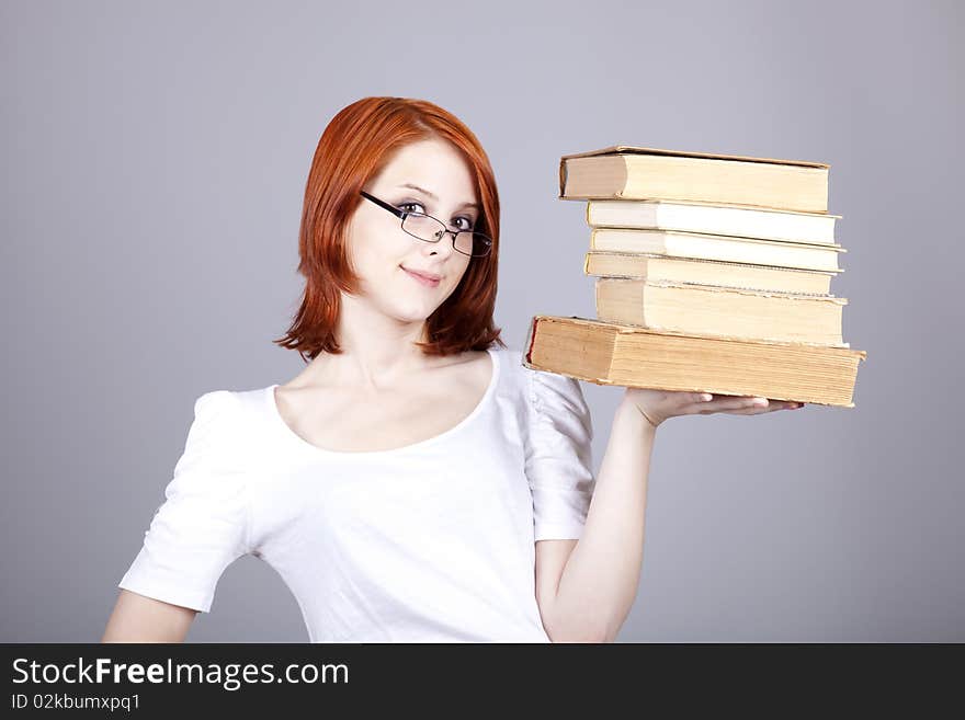 Red-haired businesswoman keep books