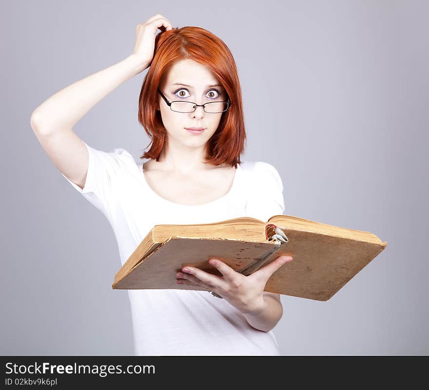 Red-haired businesswoman  keep books