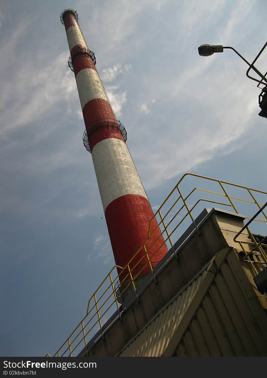 Red and white chimney in the old plant