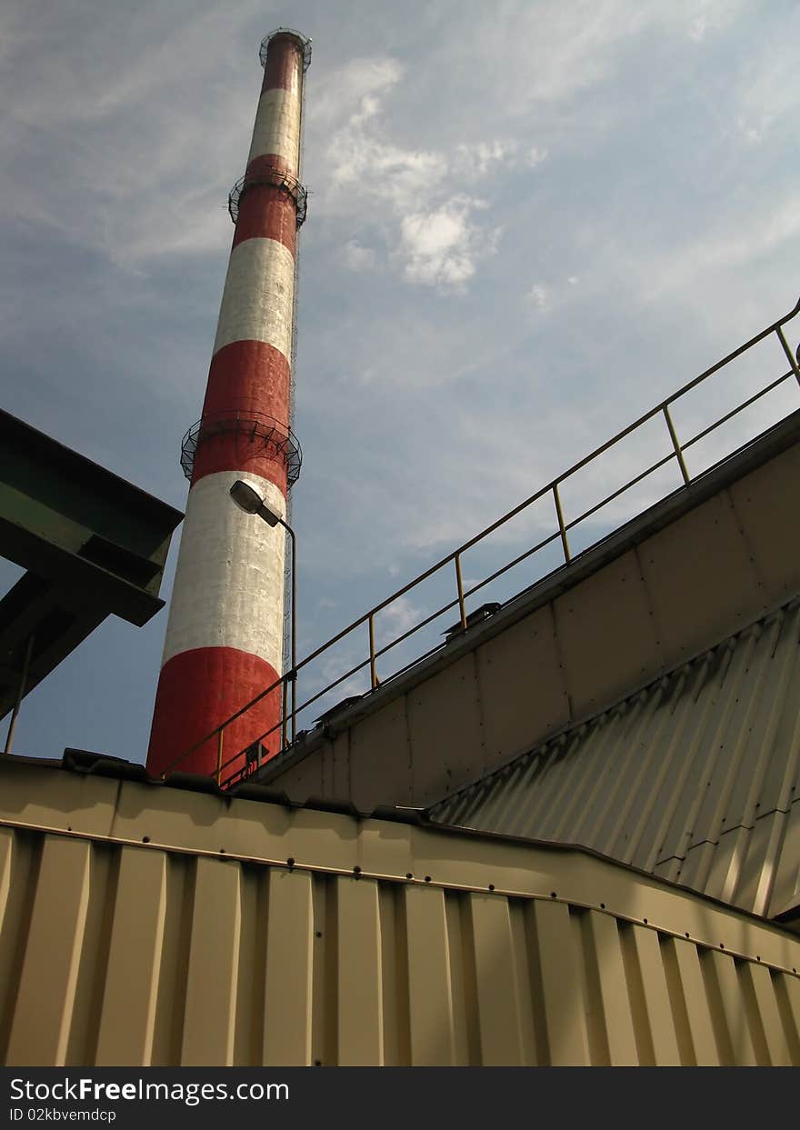 Red and white chimney in the old plant