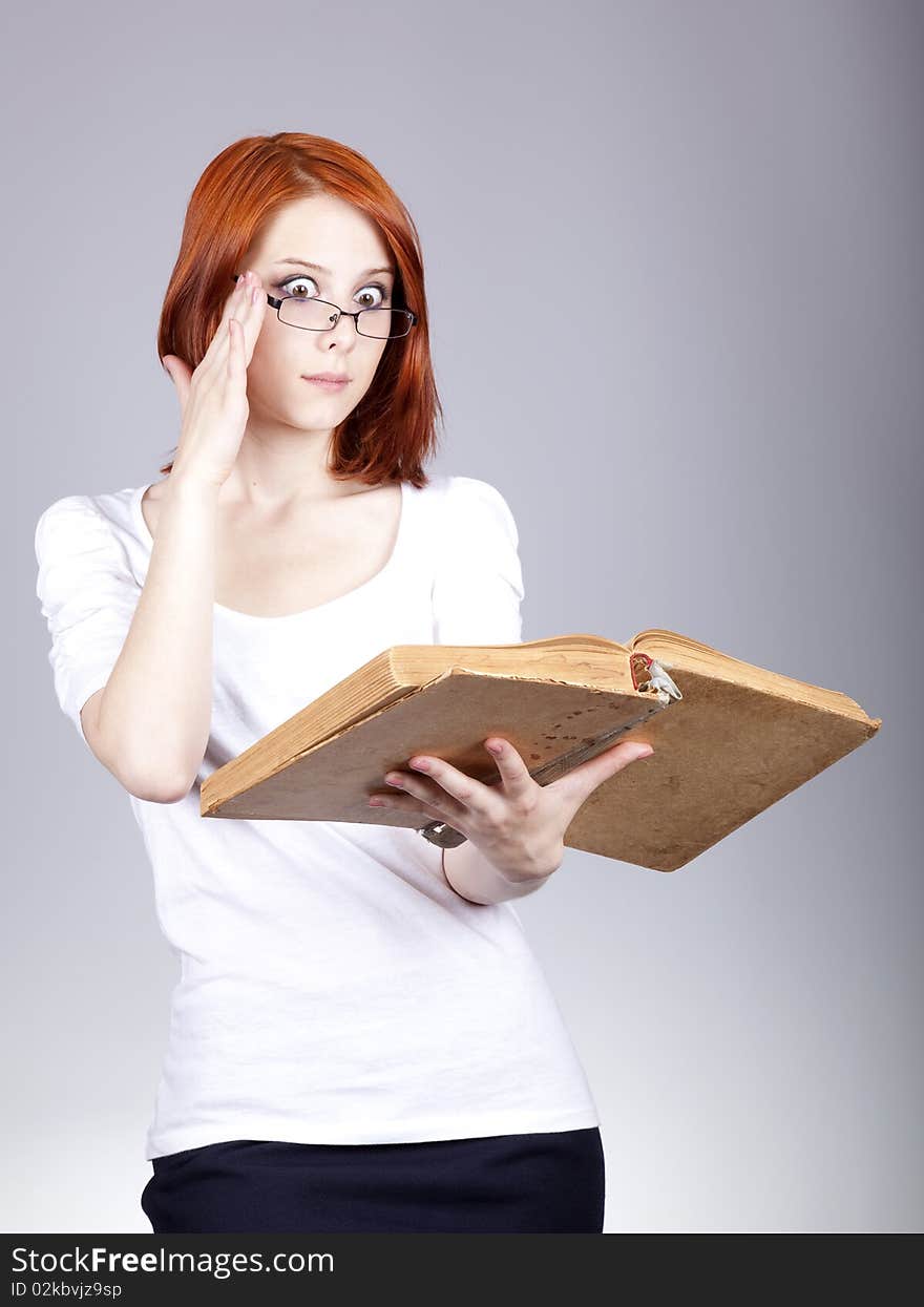 Red-haired businesswoman  keep books