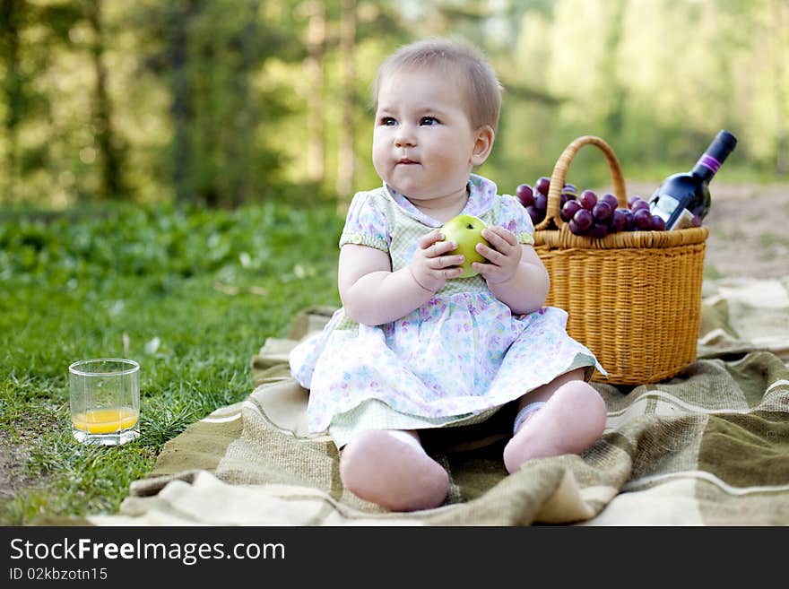 Cute baby girl having lunch in the nature. Cute baby girl having lunch in the nature