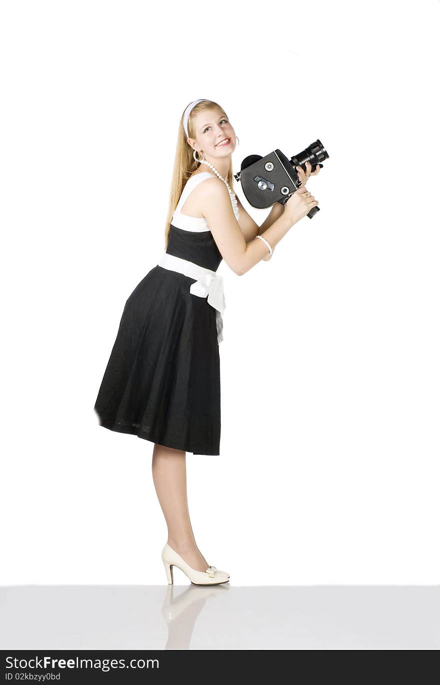 Young pretty Girl with film camera on white background