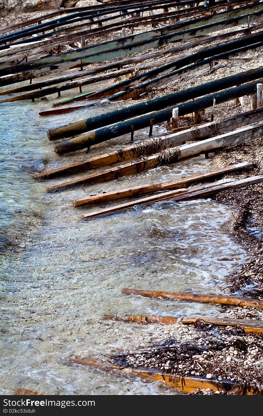 Wooden poles on the sea